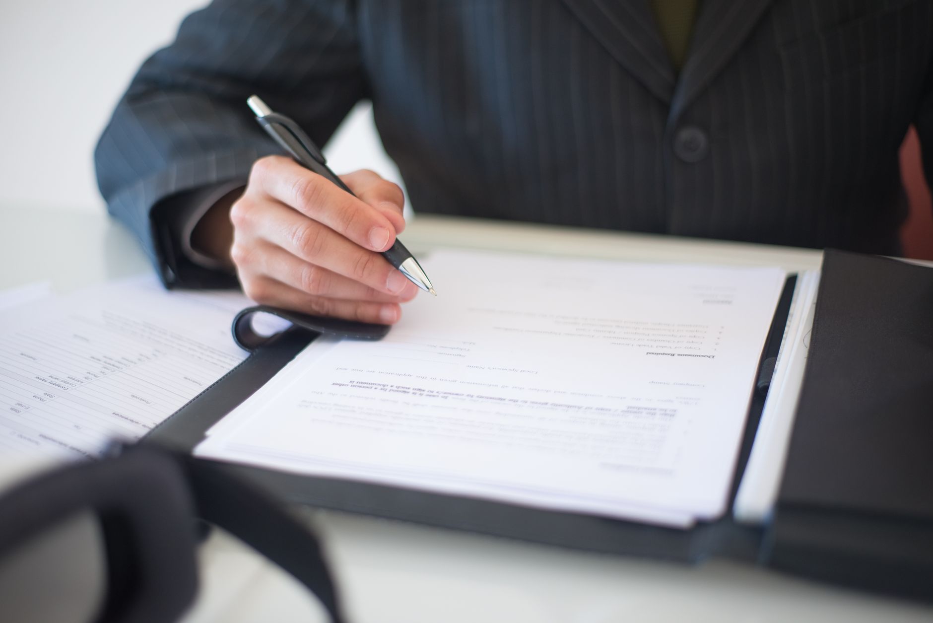 a person signing a contract